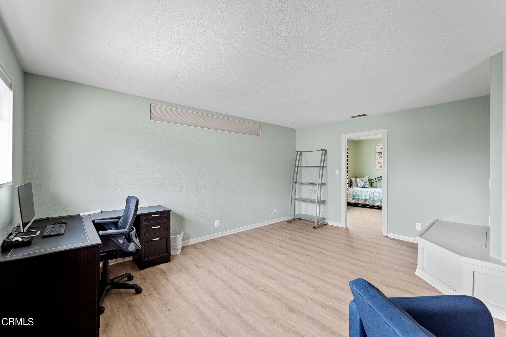 4850 Amalfi Way Oxnard, CA 93035 - Photo 30 of 51 a view of a workspace with furniture and a window