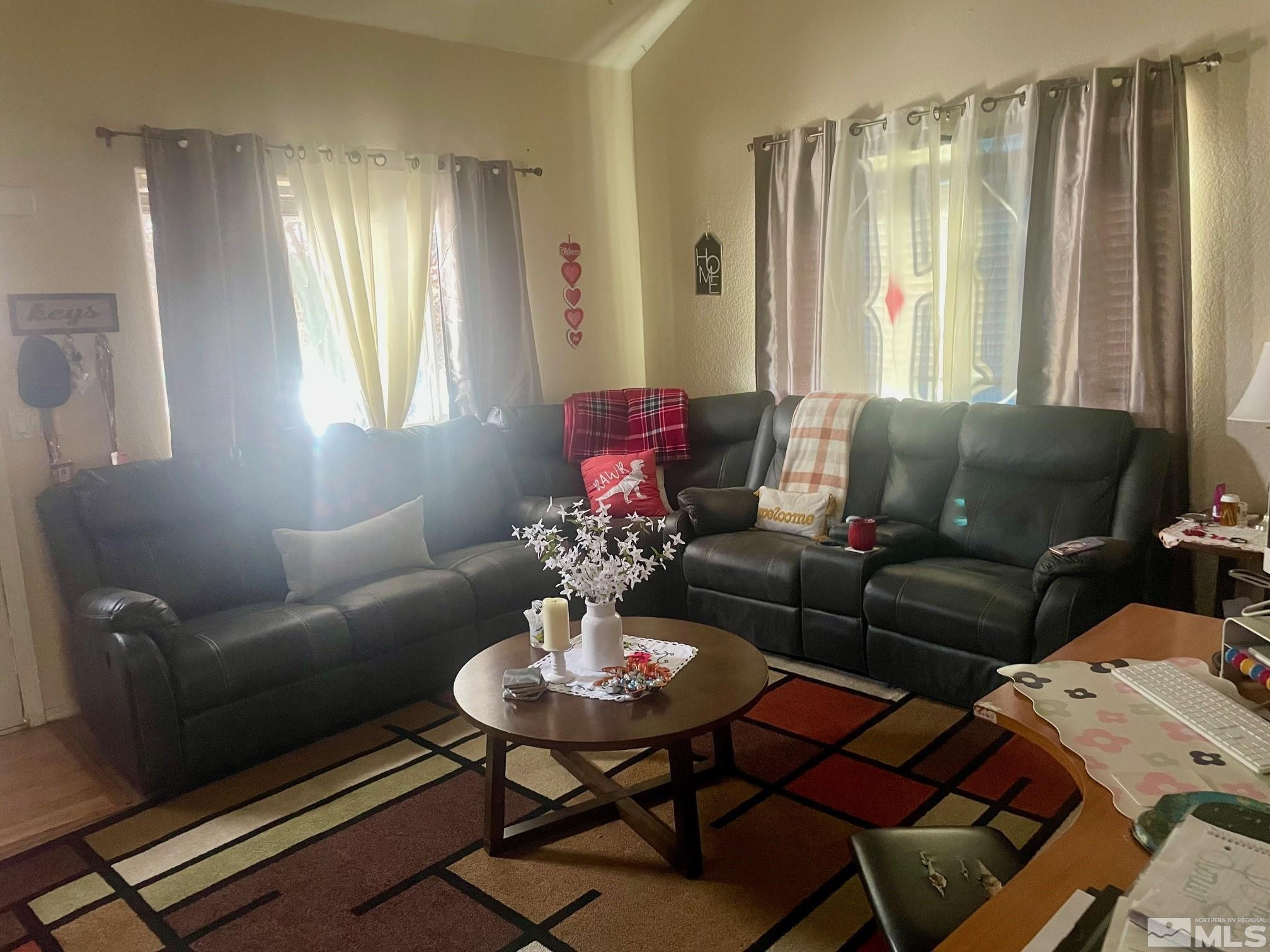 615 Edelweiss Street, Unit A & B Reno, NV 89502 - Photo 3 of 18 a living room with furniture and a large window