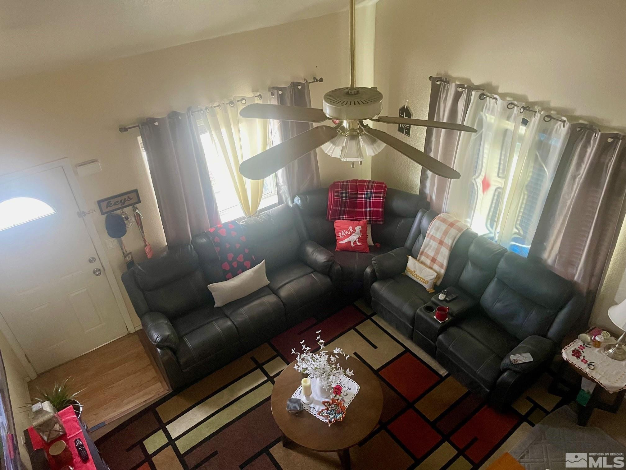 615 Edelweiss Street, Unit A & B Reno, NV 89502 - Photo 4 of 18 a living room with furniture and a chandelier
