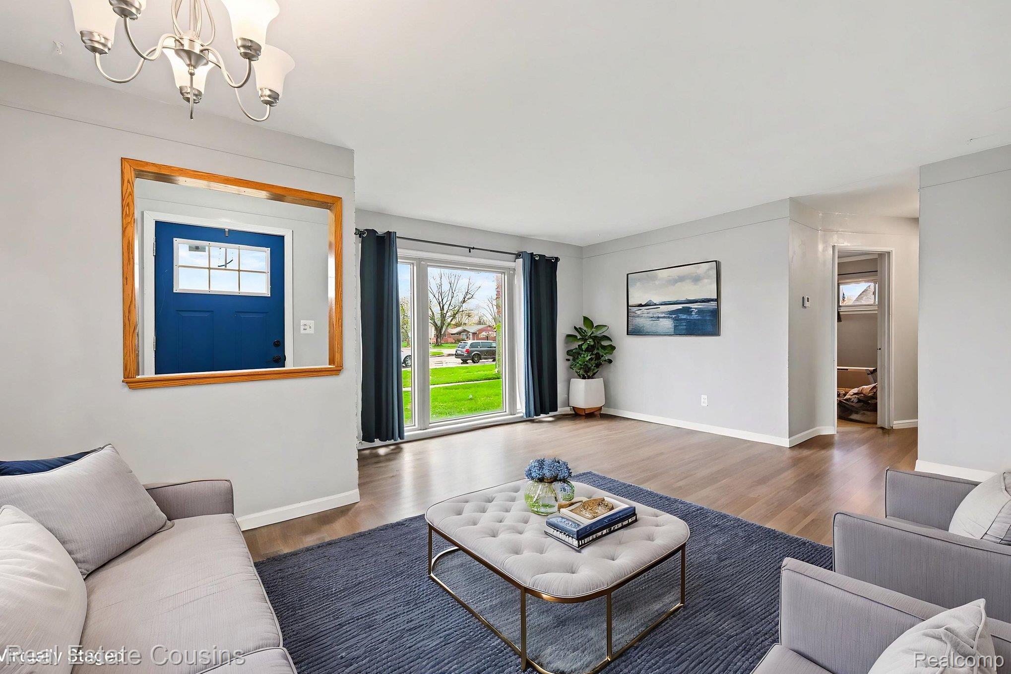 32224 Joy Road Livonia, MI 48150 - Photo 28 of 33 Living room with wood finished floors and suspended lighting