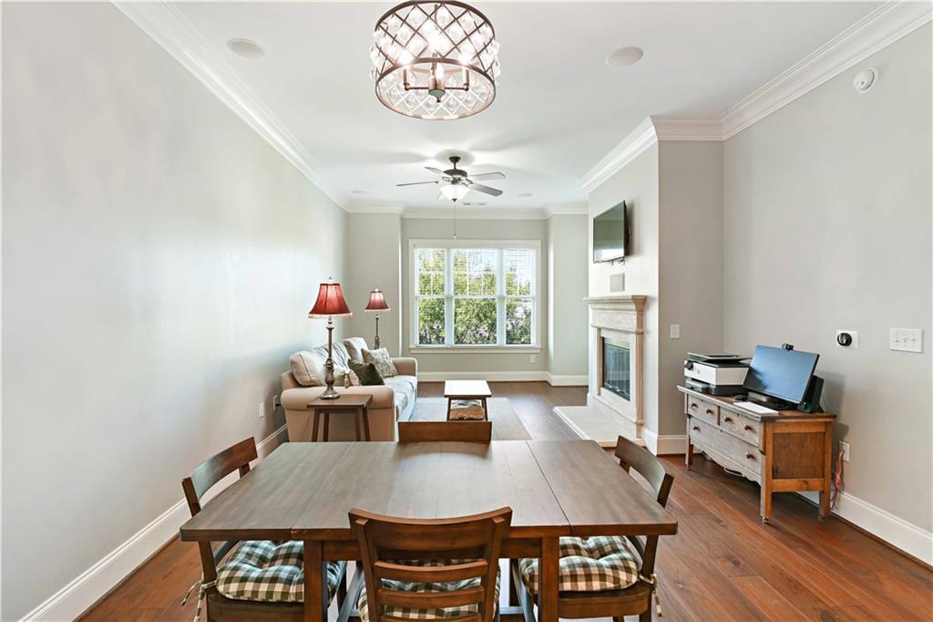 3635 East Paces Circle, Unit 1410 Atlanta, GA 30326 - Photo 11 of 68 a view of a dining room with furniture window and wooden floor