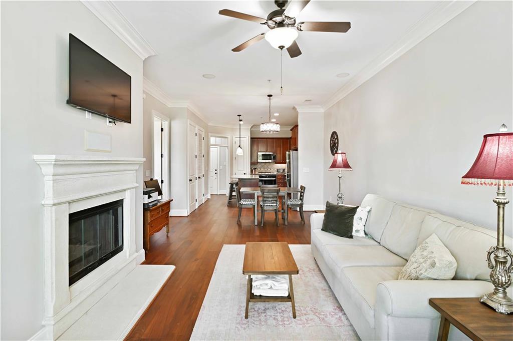 3635 East Paces Circle, Unit 1410 Atlanta, GA 30326 - Photo 2 of 68 a living room with furniture and a fireplace