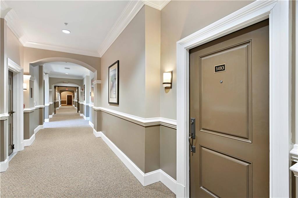 3635 East Paces Circle, Unit 1410 Atlanta, GA 30326 - Photo 36 of 68 a view of a hallway view with staircase