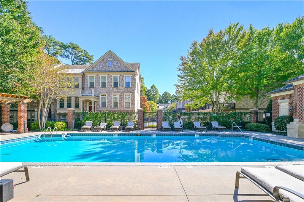 3635 East Paces Circle, Unit 1410 Atlanta, GA 30326 - Photo 42 of 68 a front view of a house with a yard