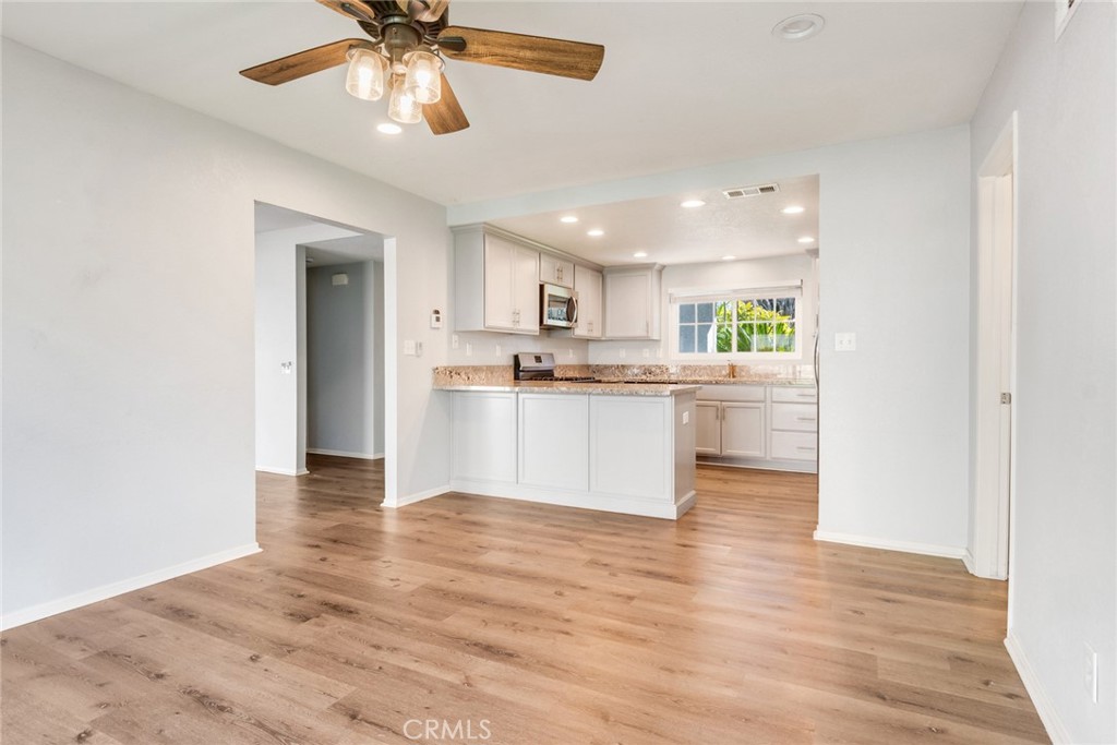 8358 Garden Street Rancho Cucamonga, CA 91701 - Photo 12 of 28 a view of kitchen with refrigerator and window