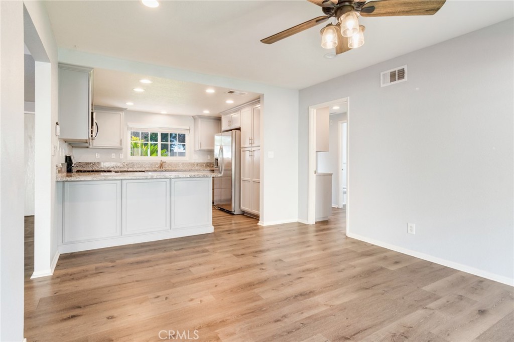 8358 Garden Street Rancho Cucamonga, CA 91701 - Photo 13 of 28 a view of a kitchen with a sink and wooden floor