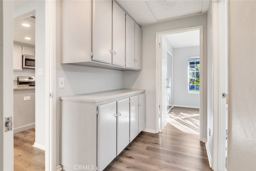 8358 Garden Street Rancho Cucamonga, CA 91701 - Photo 14 of 28 a view of hallway with wooden floor
