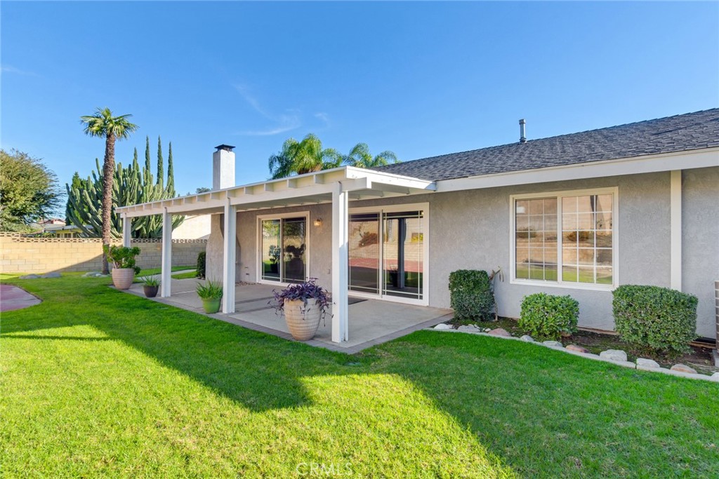 8358 Garden Street Rancho Cucamonga, CA 91701 - Photo 22 of 28 a view of a house with a yard and plants