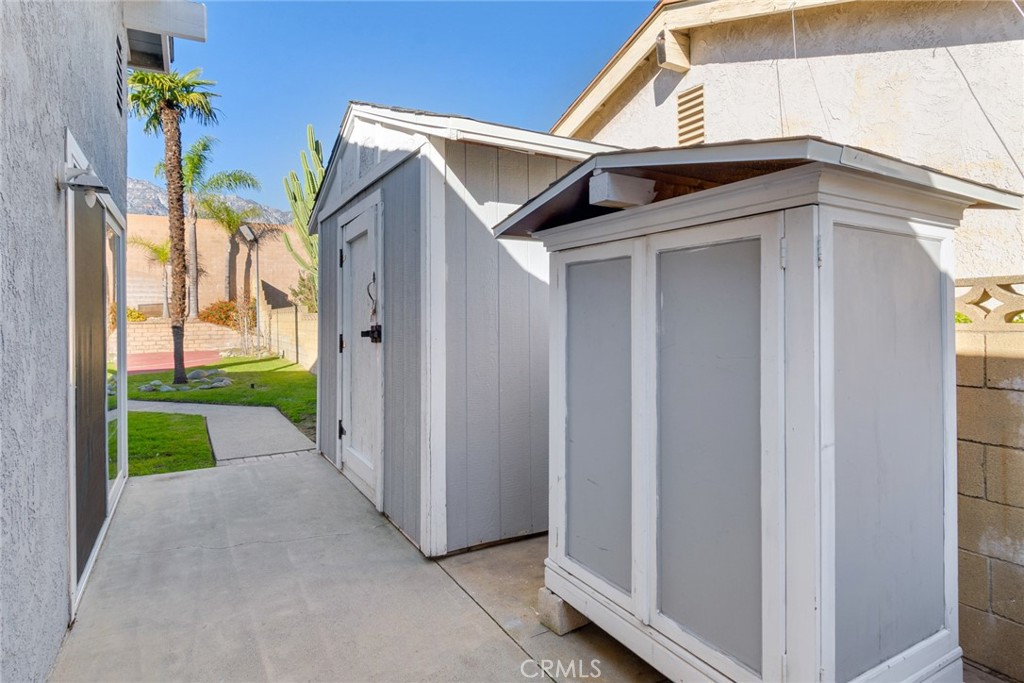 8358 Garden Street Rancho Cucamonga, CA 91701 - Photo 26 of 28 a view of a house with a small yard and floor to ceiling window