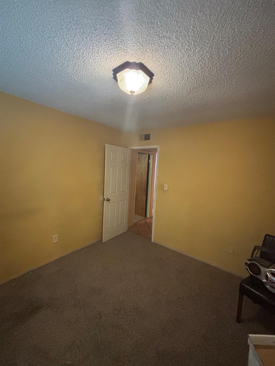 1225 Pontiac Avenue Clovis, CA 93727 - Photo 14 of 18 an empty room with a empty space and a window