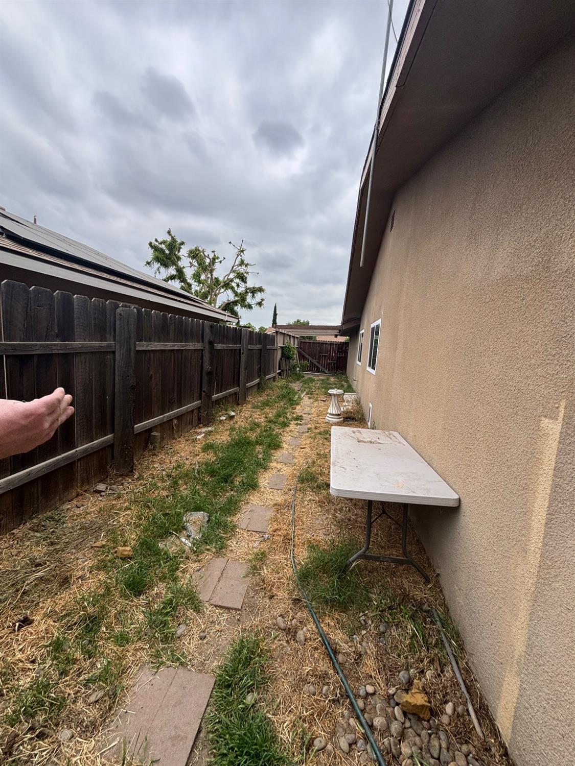 1225 Pontiac Avenue Clovis, CA 93727 - Photo 16 of 18 a backyard of a house with table and chairs