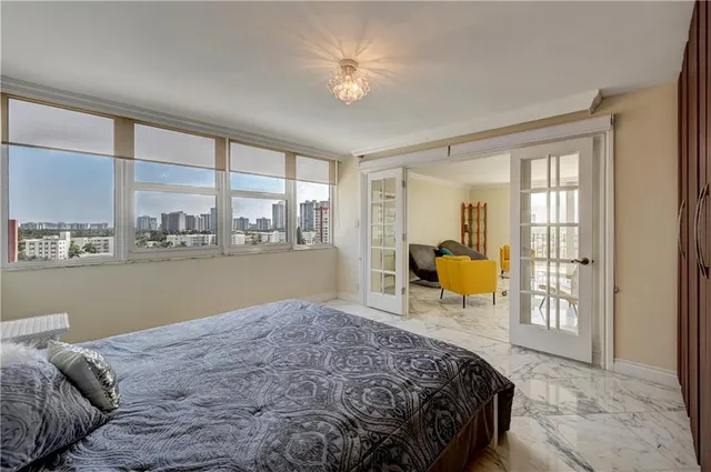 a bed room with a bed and a chair