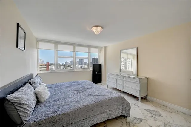 a bed room with a bed and window