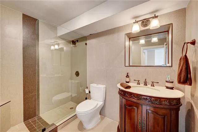 a bathroom with a shower and a toilet