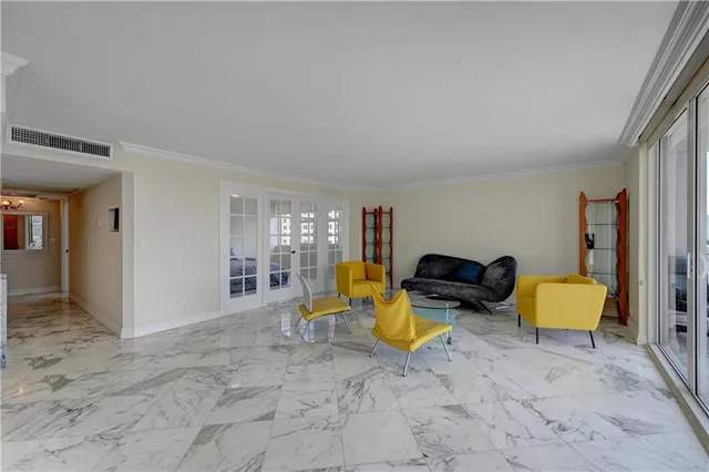 a view of a livingroom with workspace and a couch