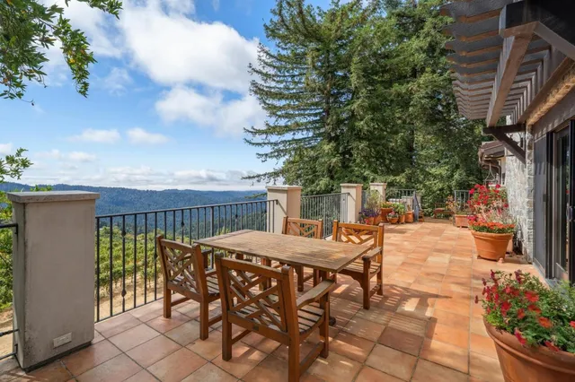 a view of a chairs and table in a patio