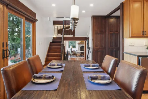 a bathroom with a sink a mirror and shower