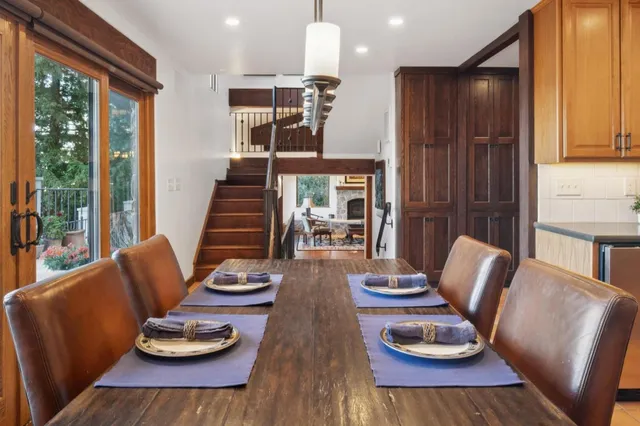 a front view of a house with a fountain