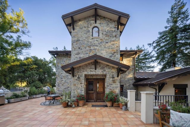 a kitchen with kitchen island a counter and a refrigerator