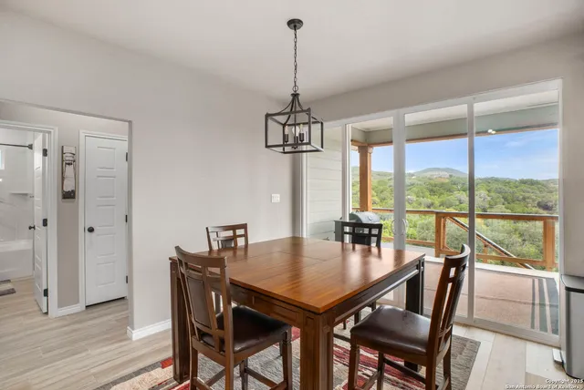 a view of a dining room with furniture window and outside view