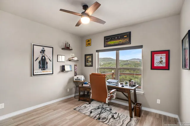 a work room with furniture and a window