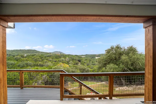 a view of mountain with wooden floor