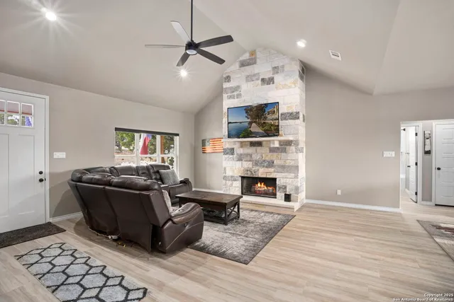a living room with furniture and a fireplace