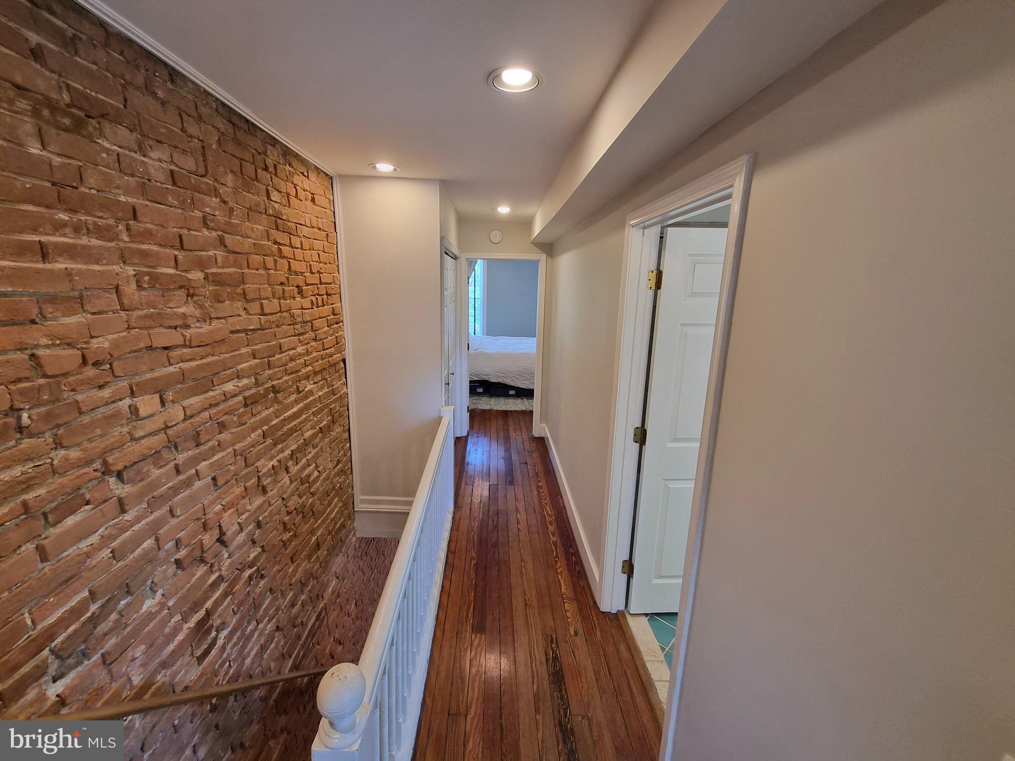 1601 Belt Street Baltimore, MD 21230 - Photo 12 of 30 a view of a hallway with wooden floor and staircase