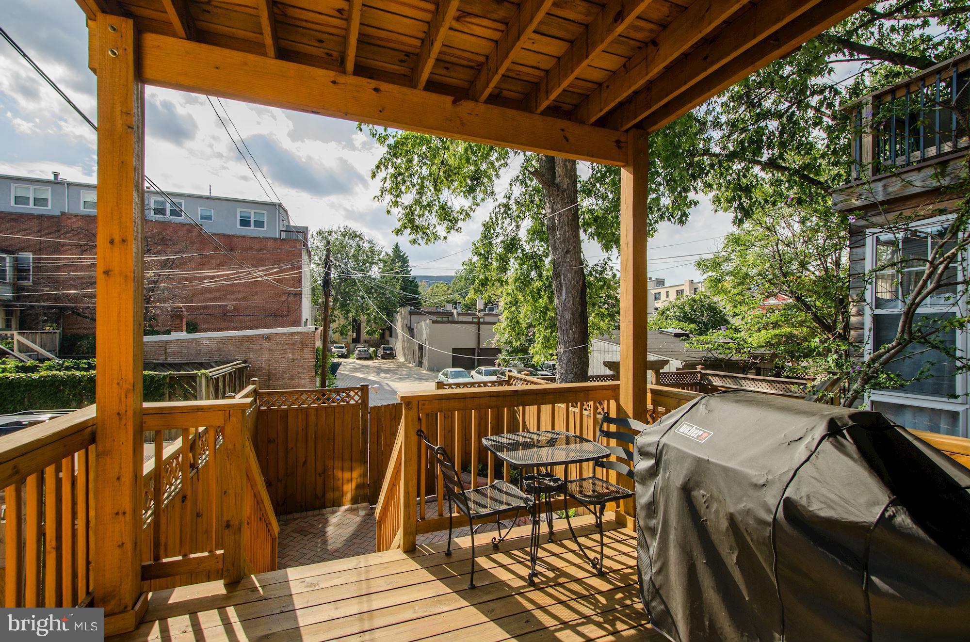 612 4th Street Northeast Washington, DC 20002 - Photo 11 of 28 a view of balcony with chairs and wooden fence
