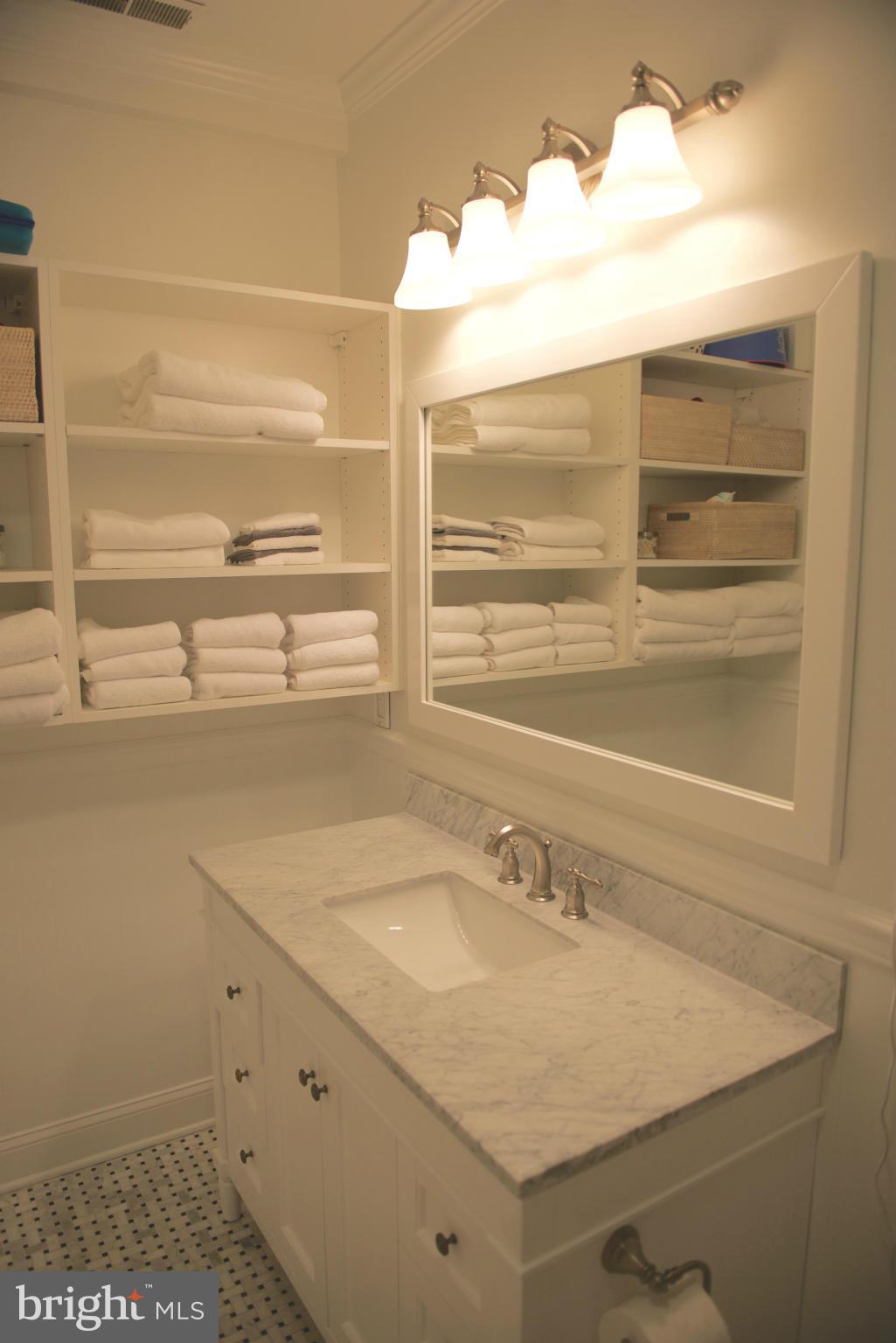 612 4th Street Northeast Washington, DC 20002 - Photo 19 of 28 a bathroom with a sink and a mirror