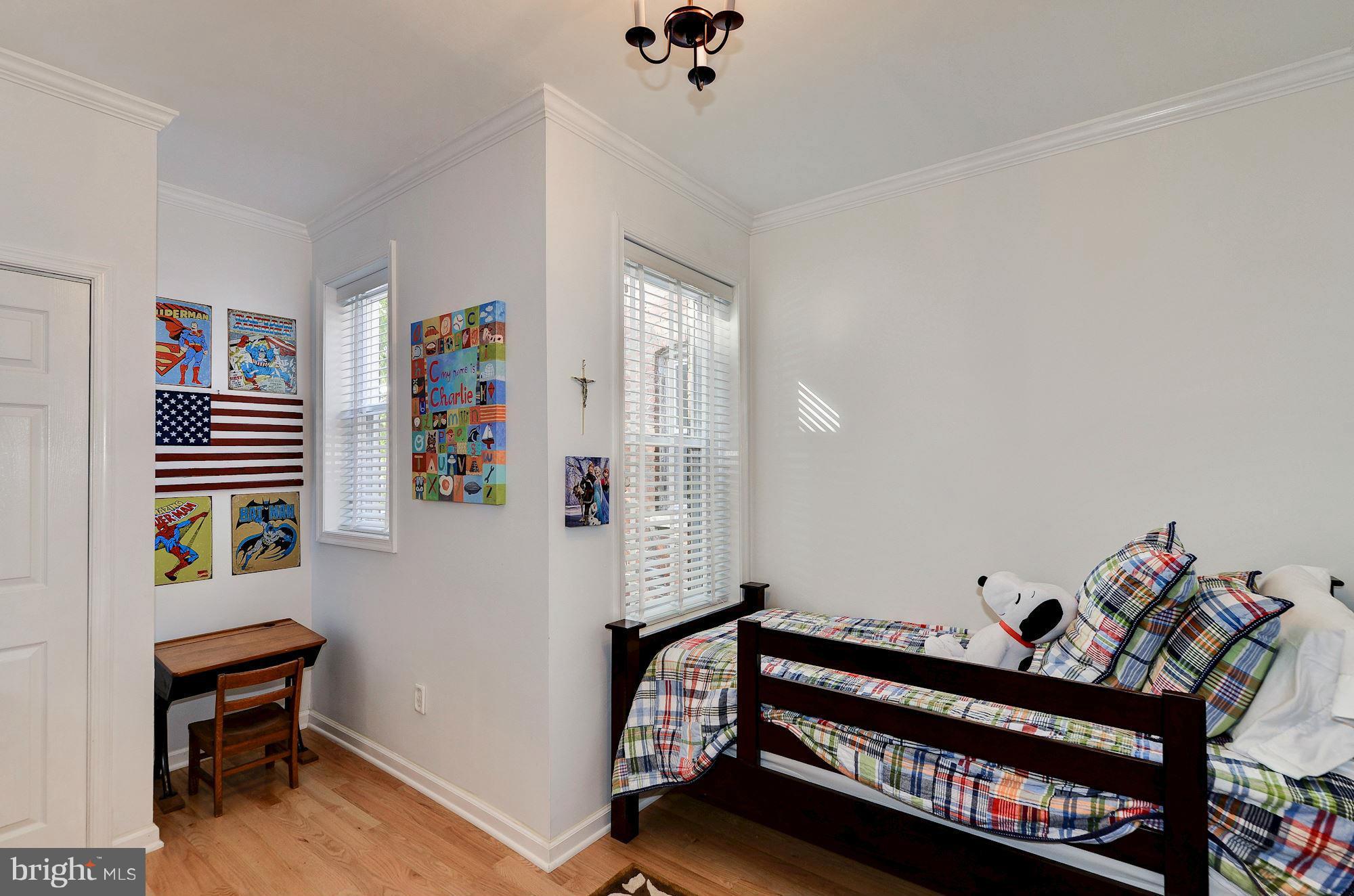 612 4th Street Northeast Washington, DC 20002 - Photo 20 of 28 a bedroom with furniture and a window