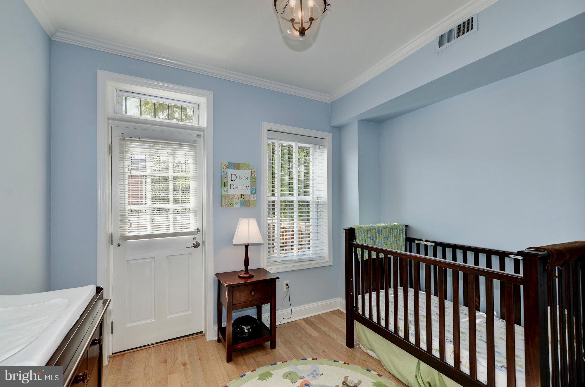 612 4th Street Northeast Washington, DC 20002 - Photo 21 of 28 a bedroom with a bed and a window