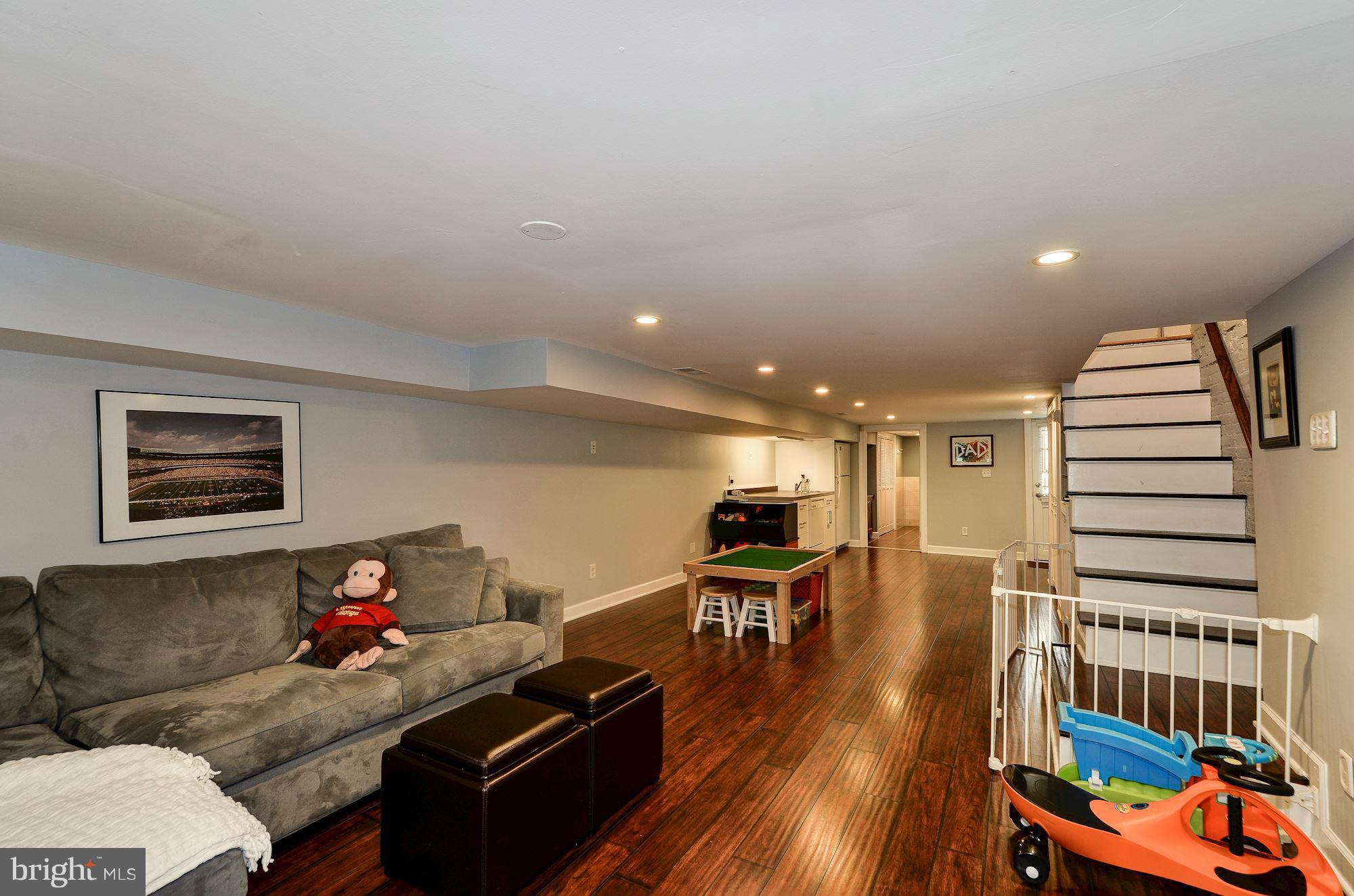 612 4th Street Northeast Washington, DC 20002 - Photo 23 of 28 a living room with furniture and wooden floor