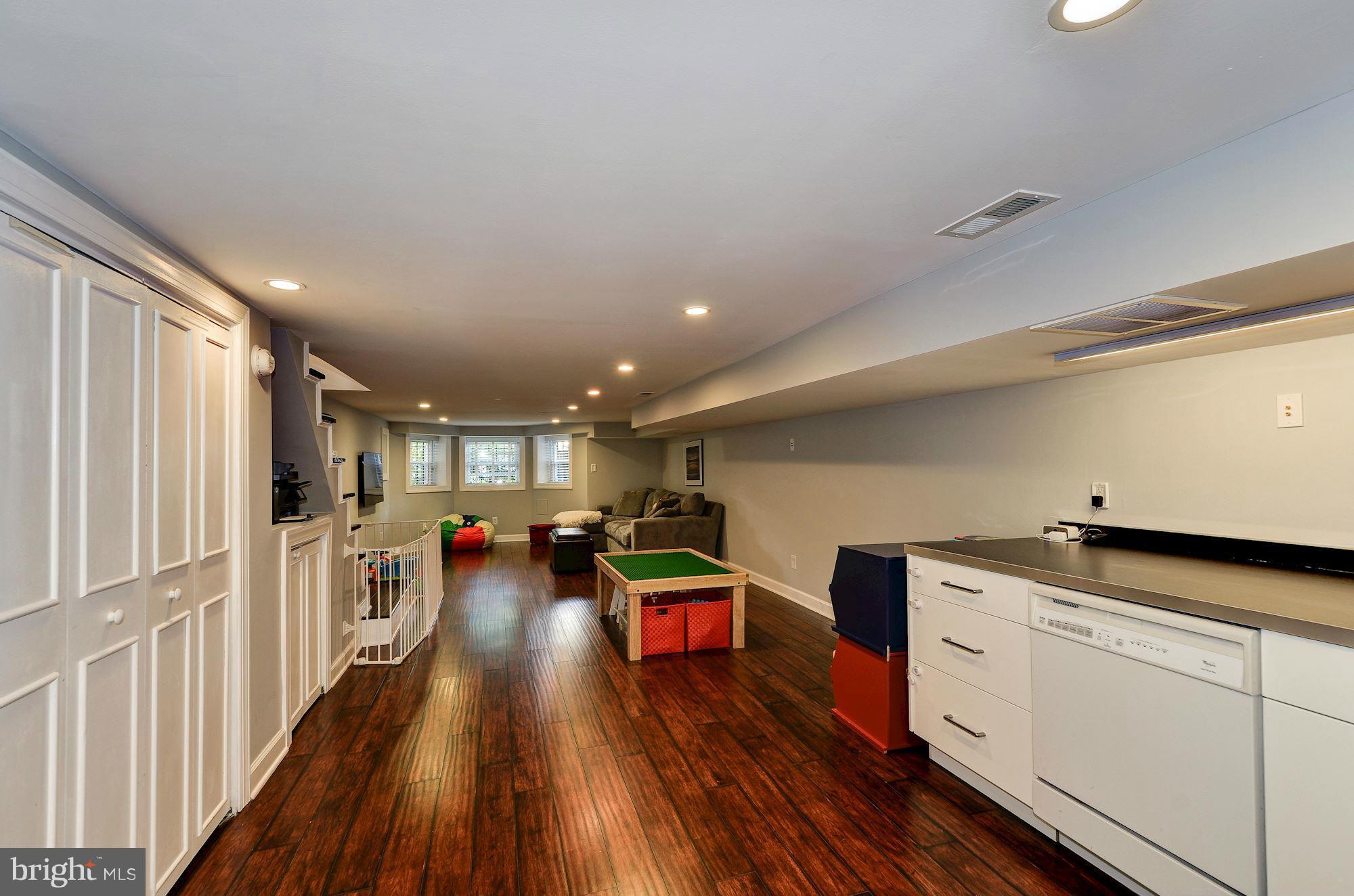 612 4th Street Northeast Washington, DC 20002 - Photo 27 of 28 a kitchen with lots of counter top space and wooden floor