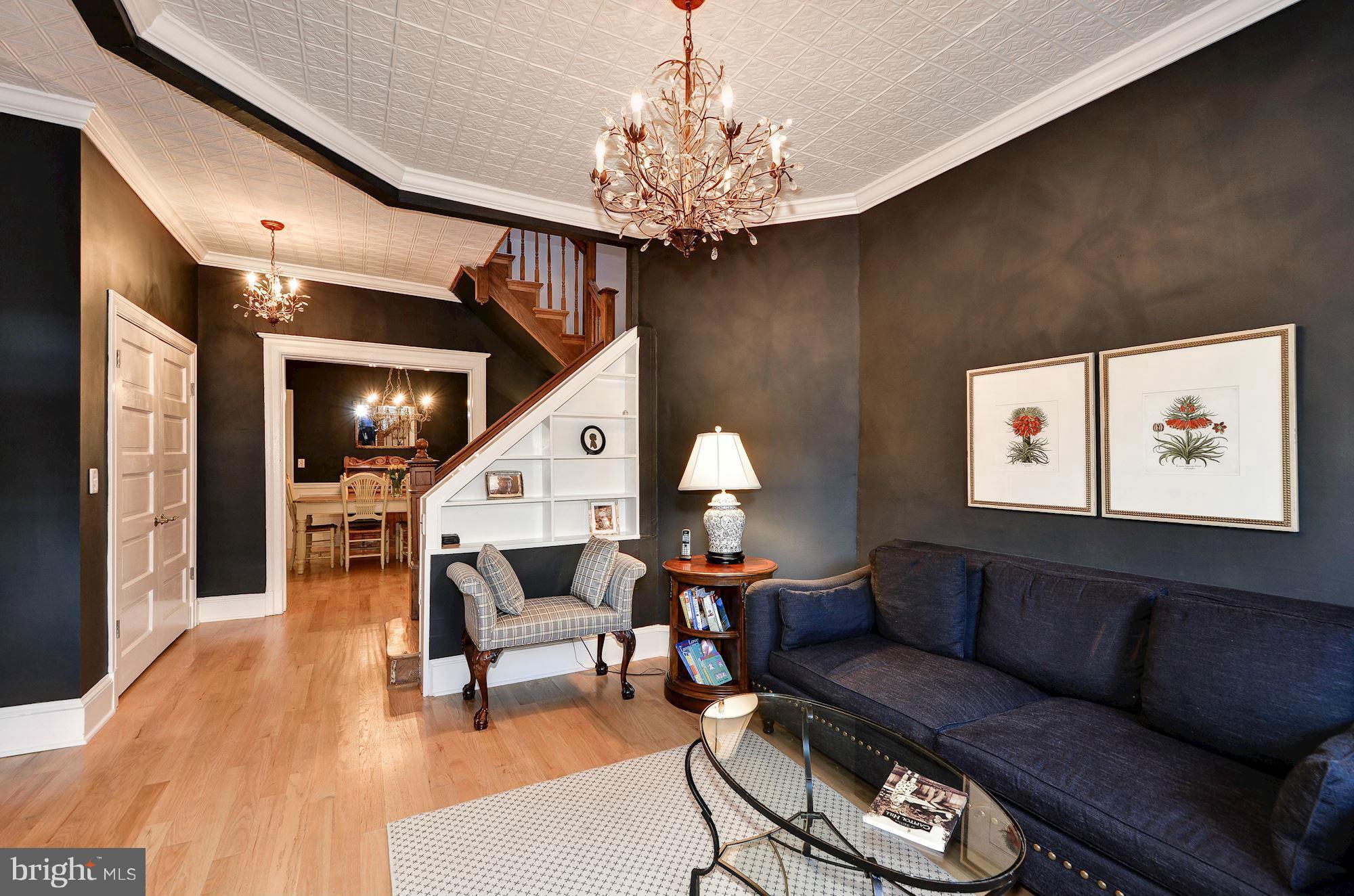 612 4th Street Northeast Washington, DC 20002 - Photo 4 of 28 a living room with furniture and a chandelier