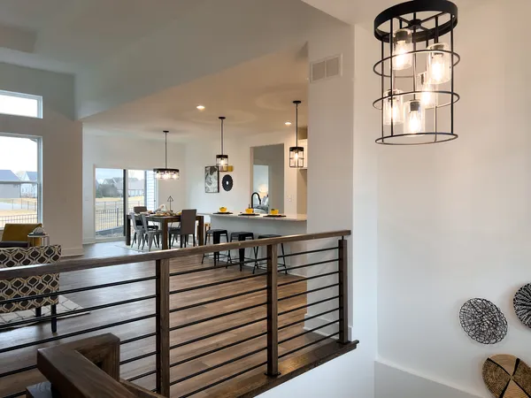 a kitchen with stainless steel appliances kitchen island a stove a sink and a refrigerator