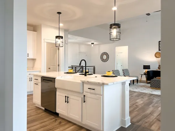 a kitchen with a dining table and chairs in it
