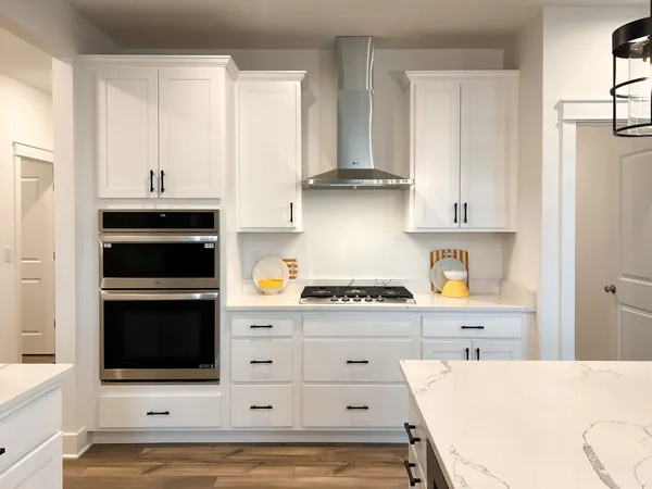 a spacious bedroom with a bed and a couch