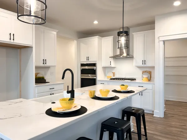 a spacious bedroom with a bed and a couch