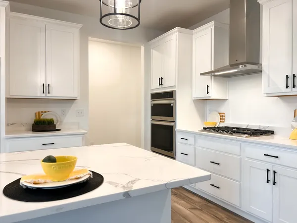 a bathroom with double vanity sinks and a mirror