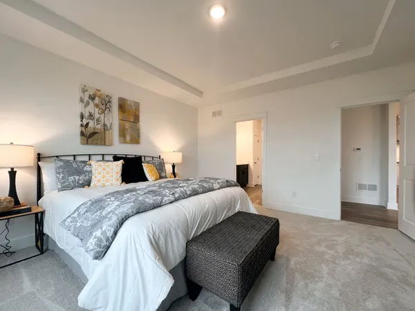 a en suite bathroom with a double vanity sink a mirror and shower