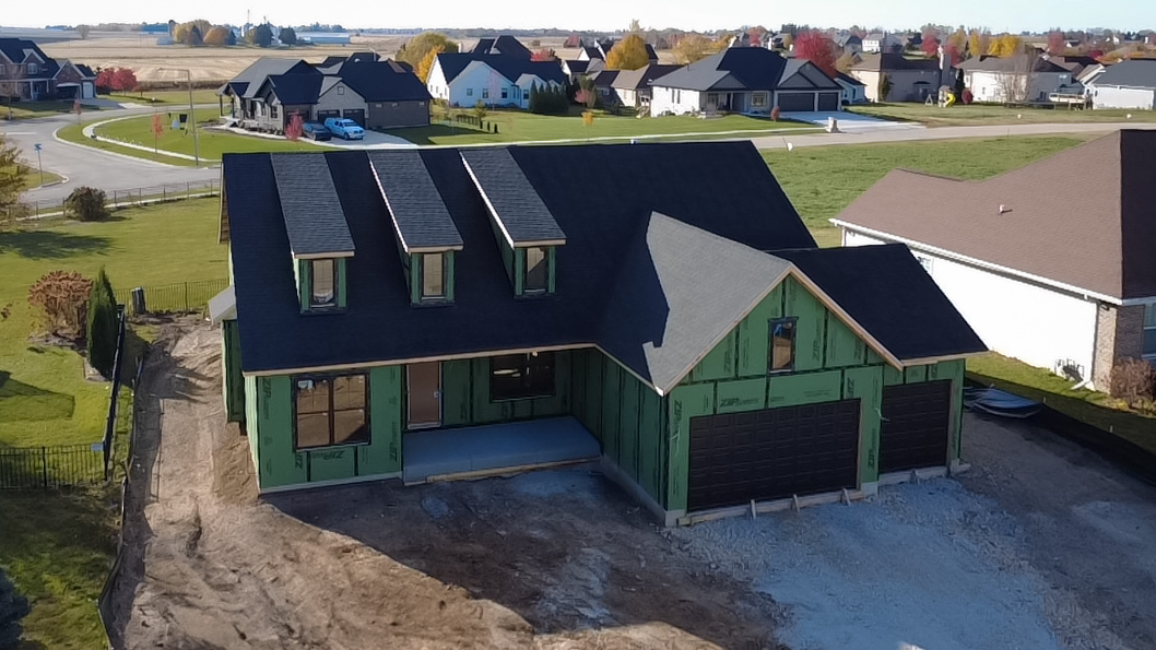 668 East Becker Place Sycamore, IL 60178 - Photo 3 of 34 a aerial view of a house with a garden and lake view