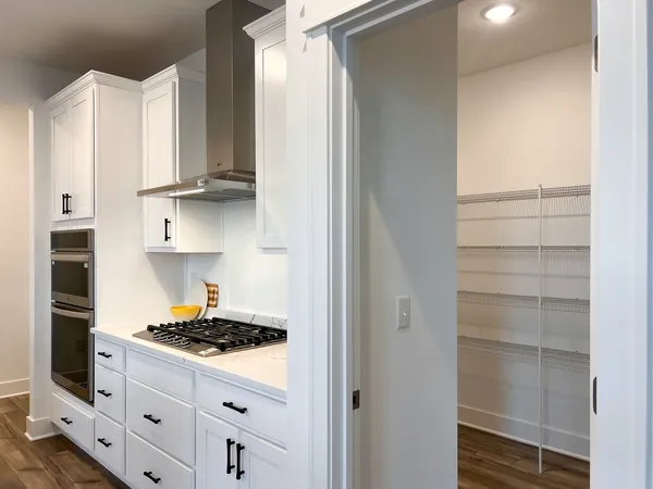 a kitchen with cabinets and appliances