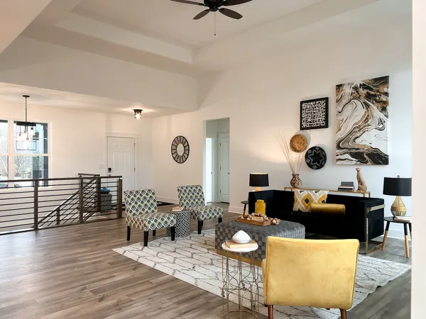 a living room with furniture fireplace and a flat screen tv