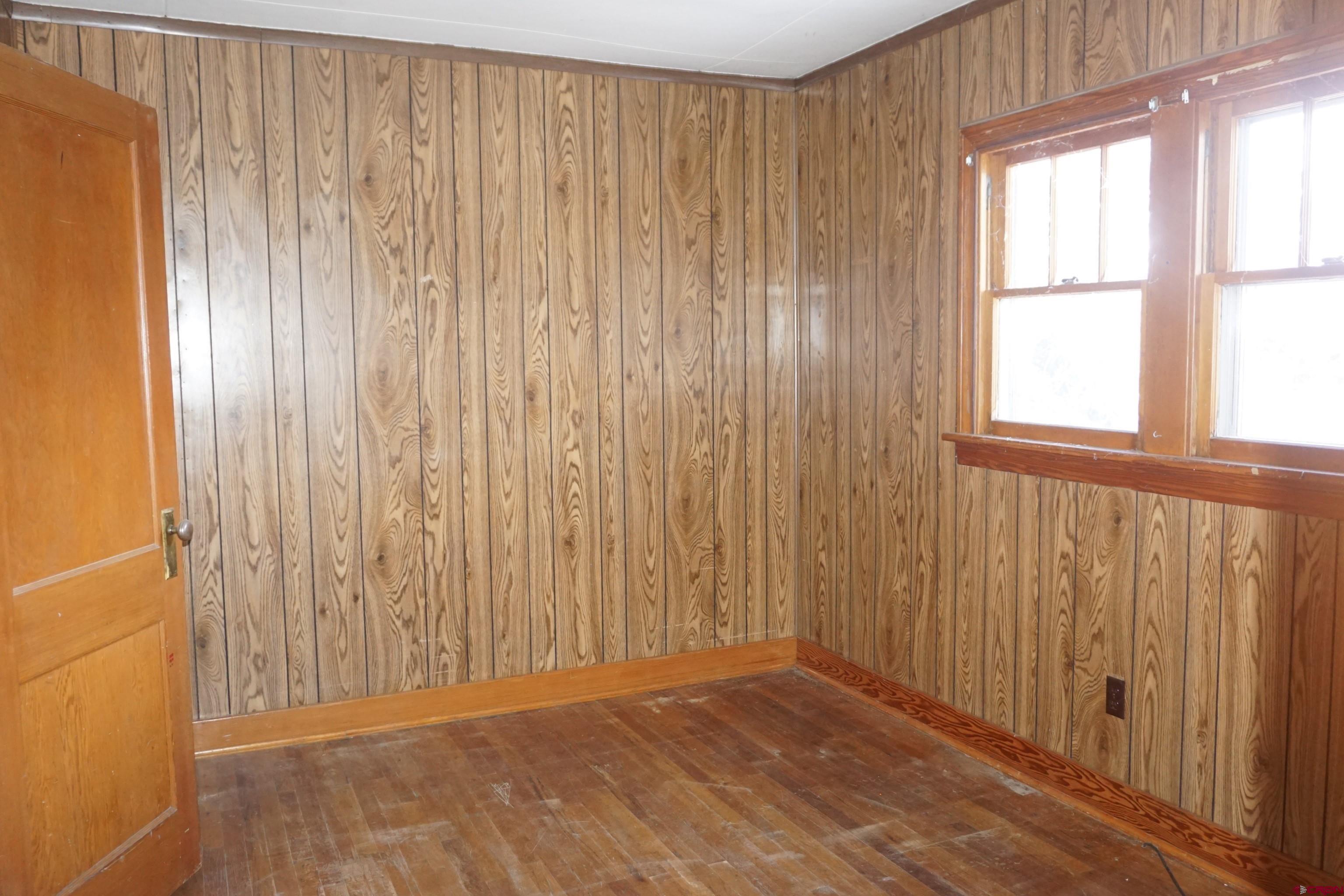 19235 2325th Road Cedaredge, CO 81413 - Photo 15 of 34 an empty room with windows