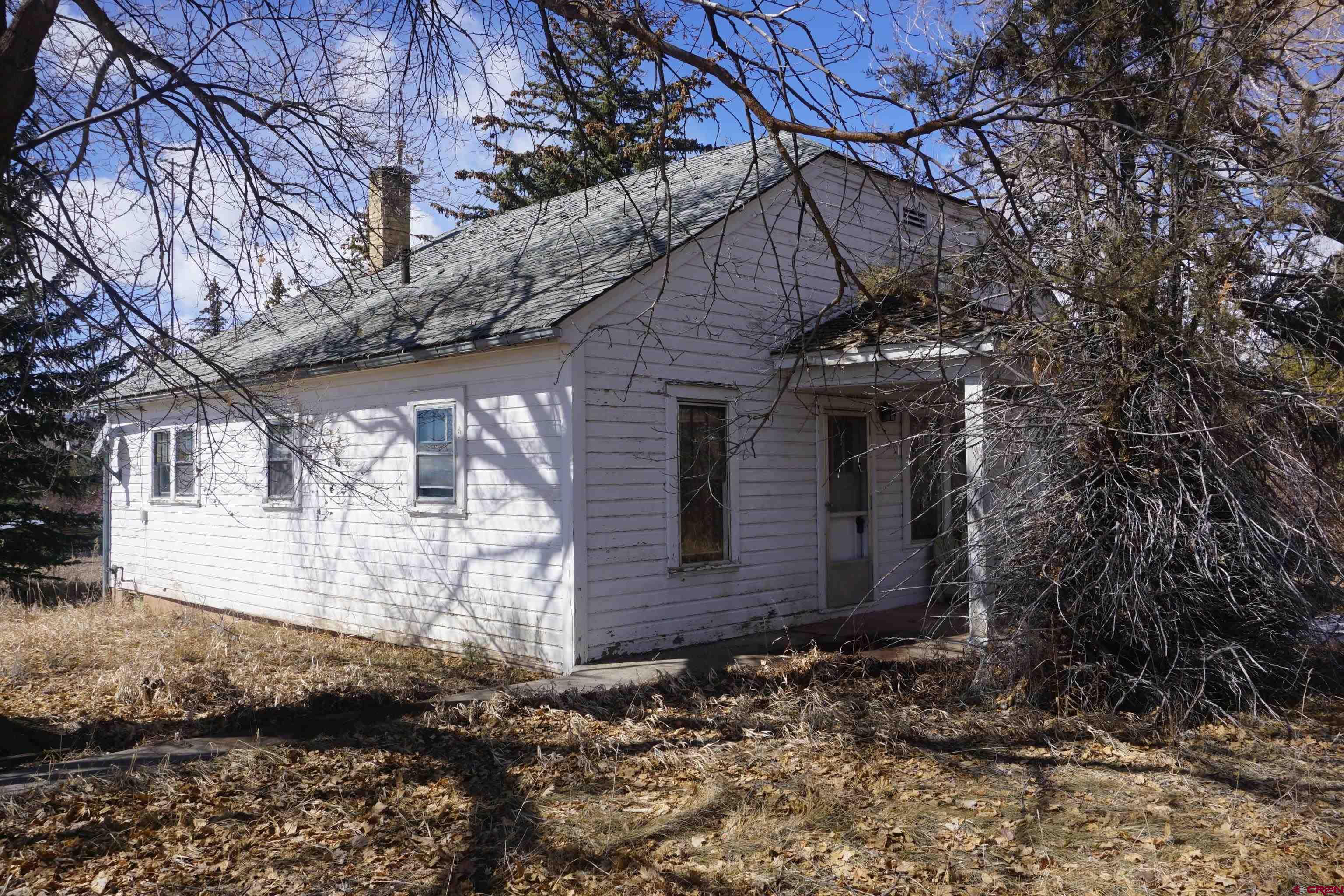 19235 2325th Road Cedaredge, CO 81413 - Photo 21 of 34 a view of a house with a yard