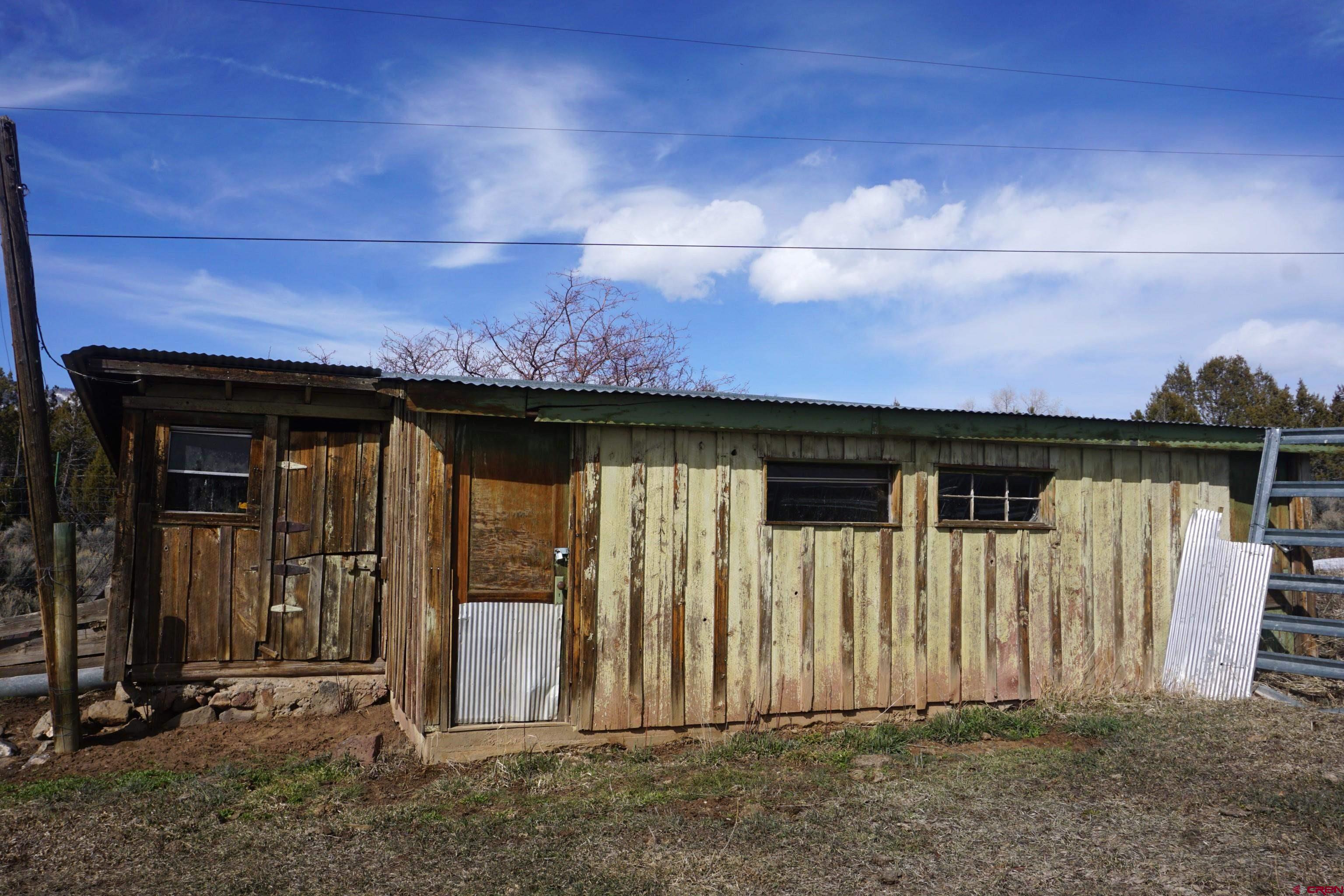 19235 2325th Road Cedaredge, CO 81413 - Photo 26 of 34 a view of a house with wooden fence