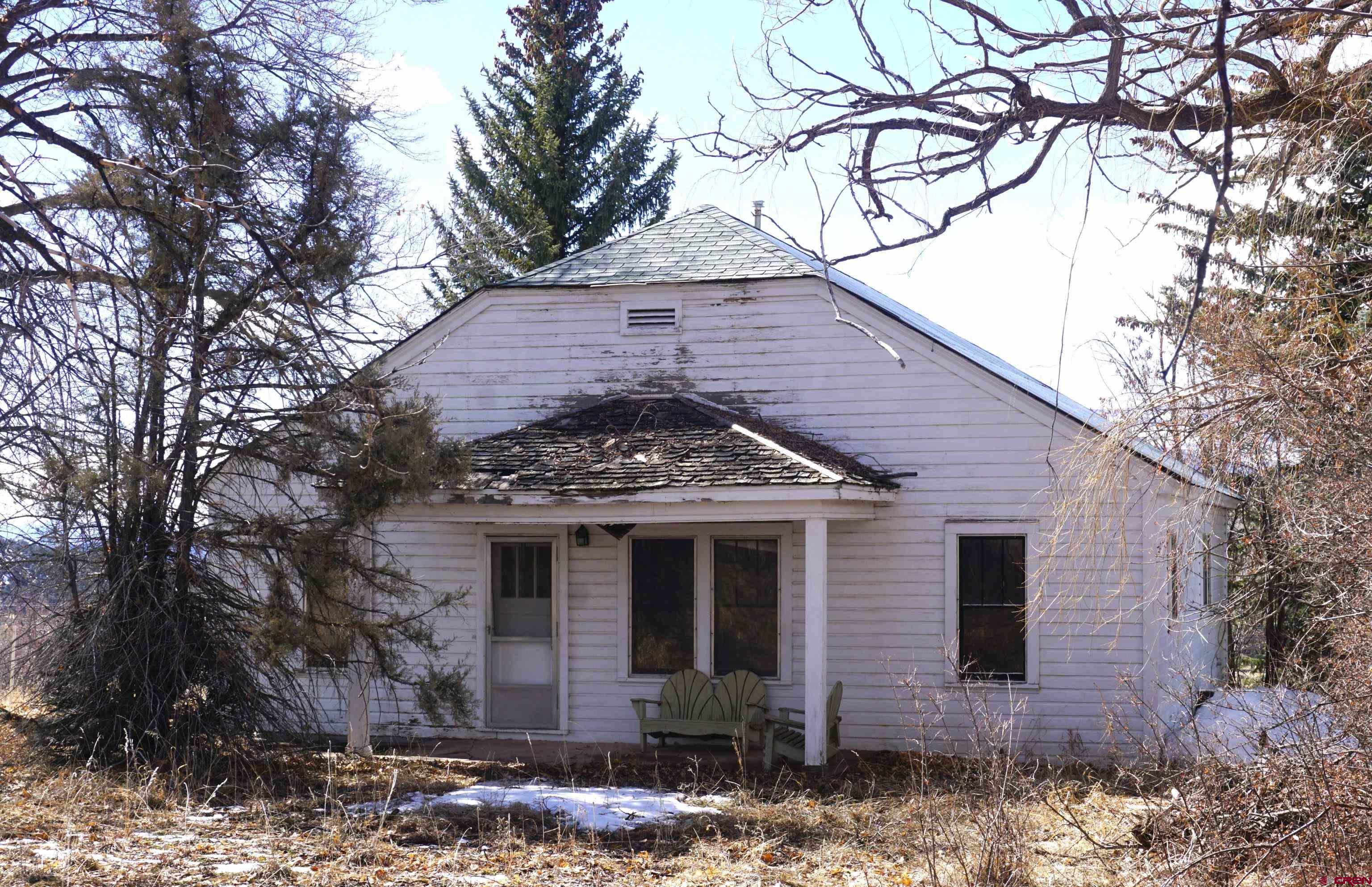 19235 2325th Road Cedaredge, CO 81413 - Photo 6 of 34 a front view of a house with garden