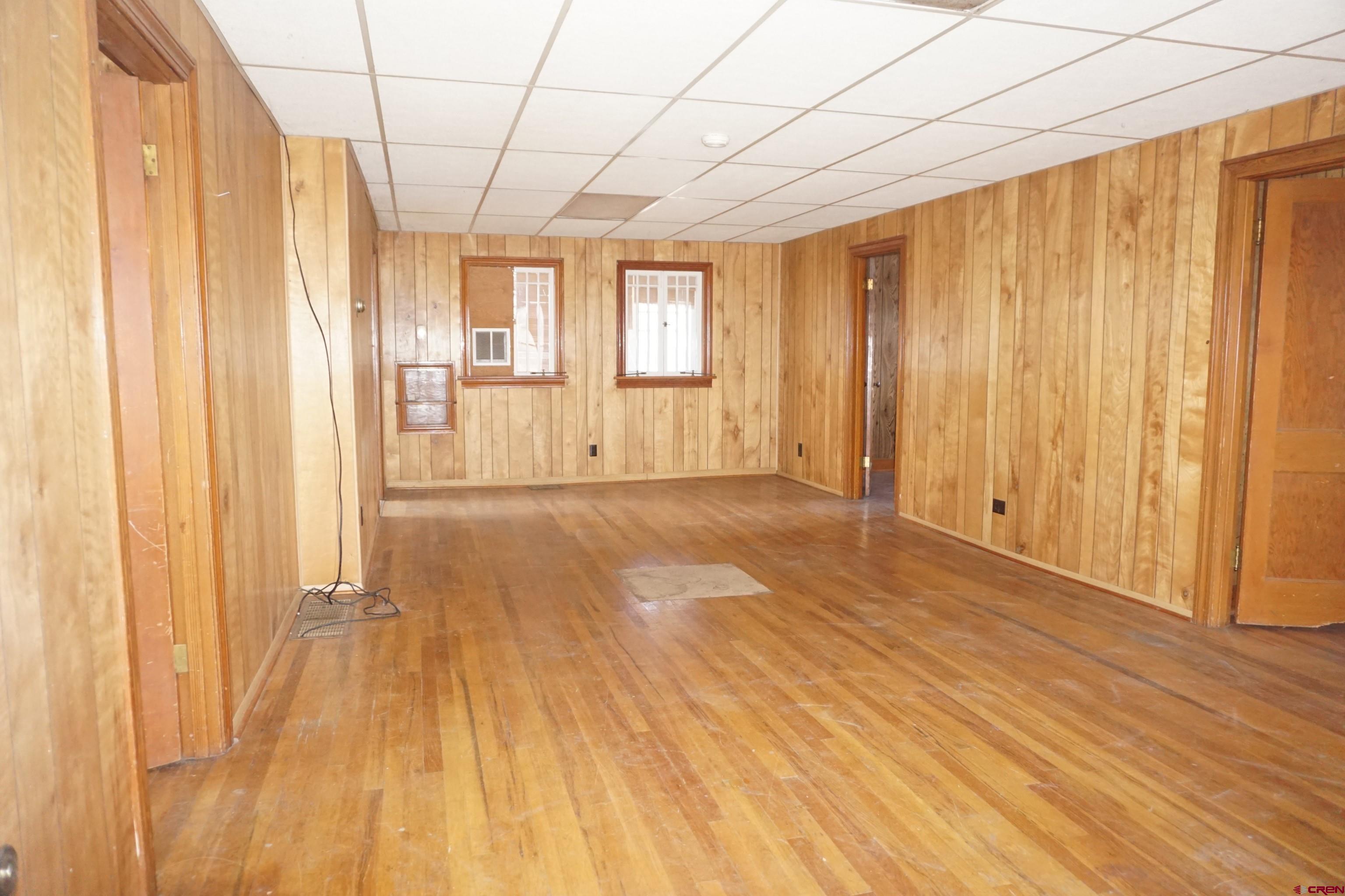19235 2325th Road Cedaredge, CO 81413 - Photo 7 of 34 a view of a room with wooden floor and staircase