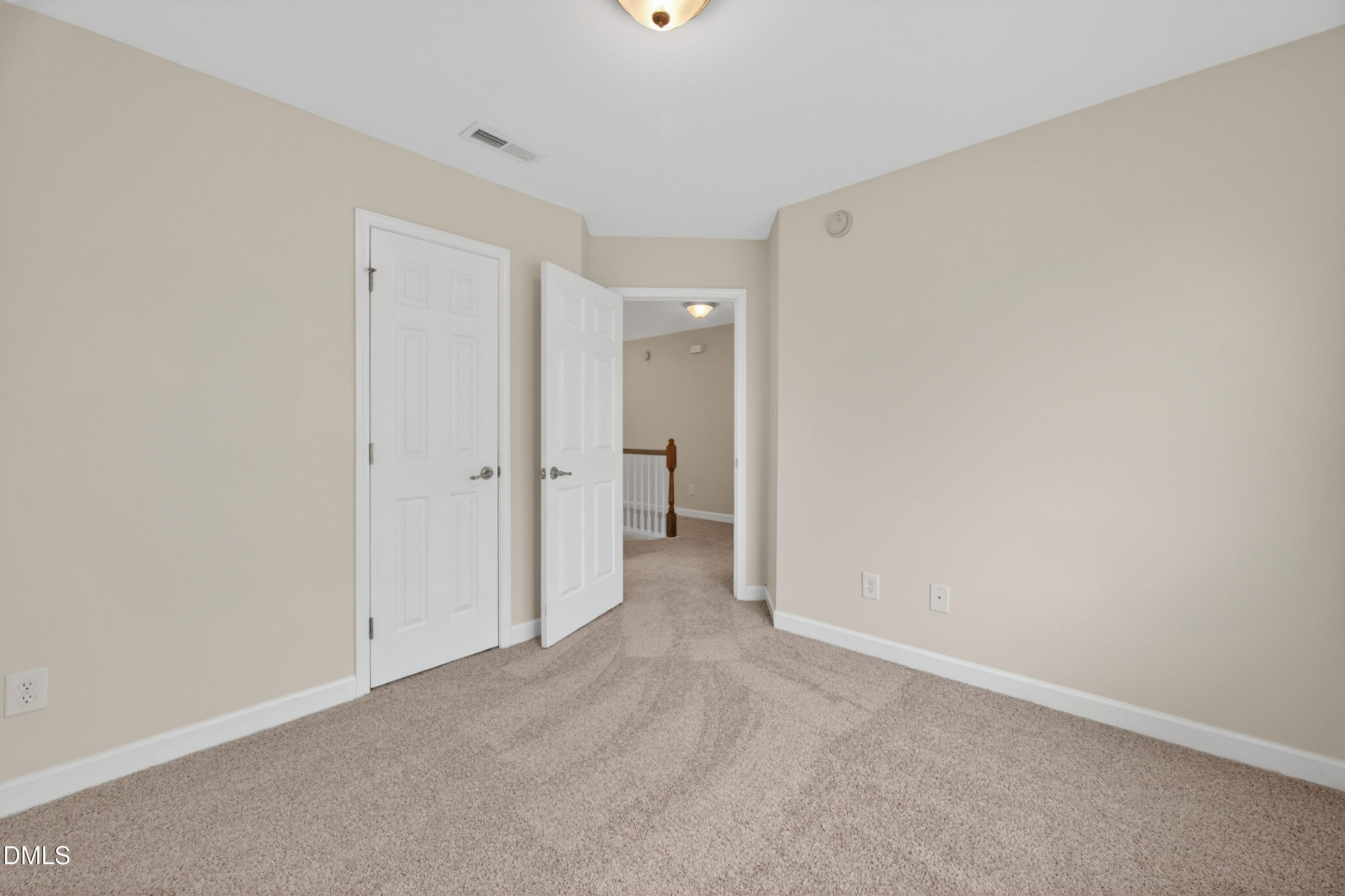 5304 Stone Station Drive Raleigh, NC 27616 - Photo 29 of 34 a view of a room with an entryway and a hallway